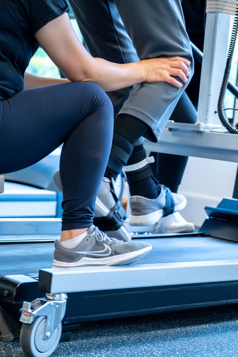 Push to Walk Employee assisting a client on the treadmill