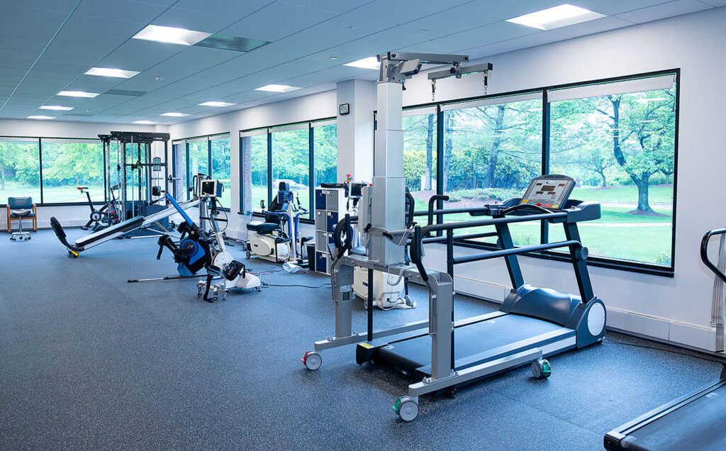 The state-of-the-art Push to Walk gym with windows behind equipment